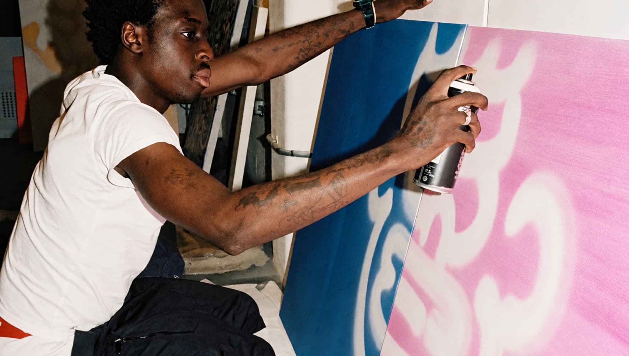 Slawn spray-painting in the studio