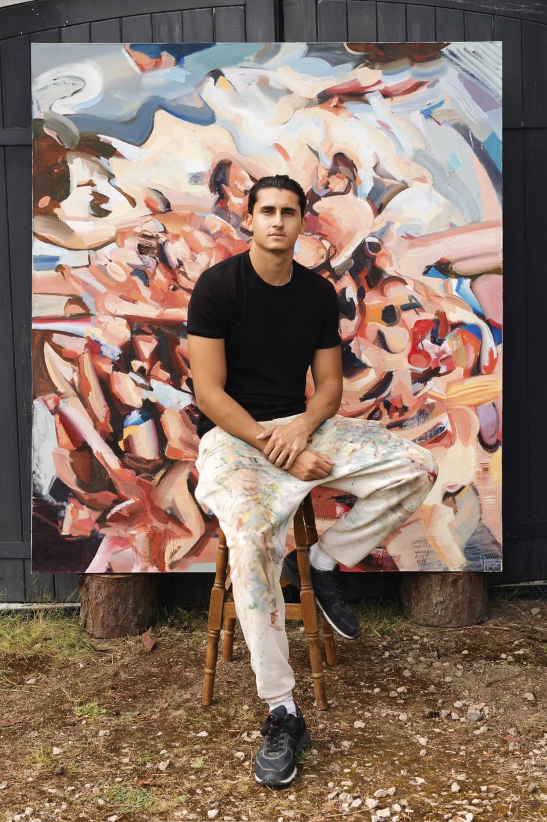 Lucas Console-Verma with one of his paintings